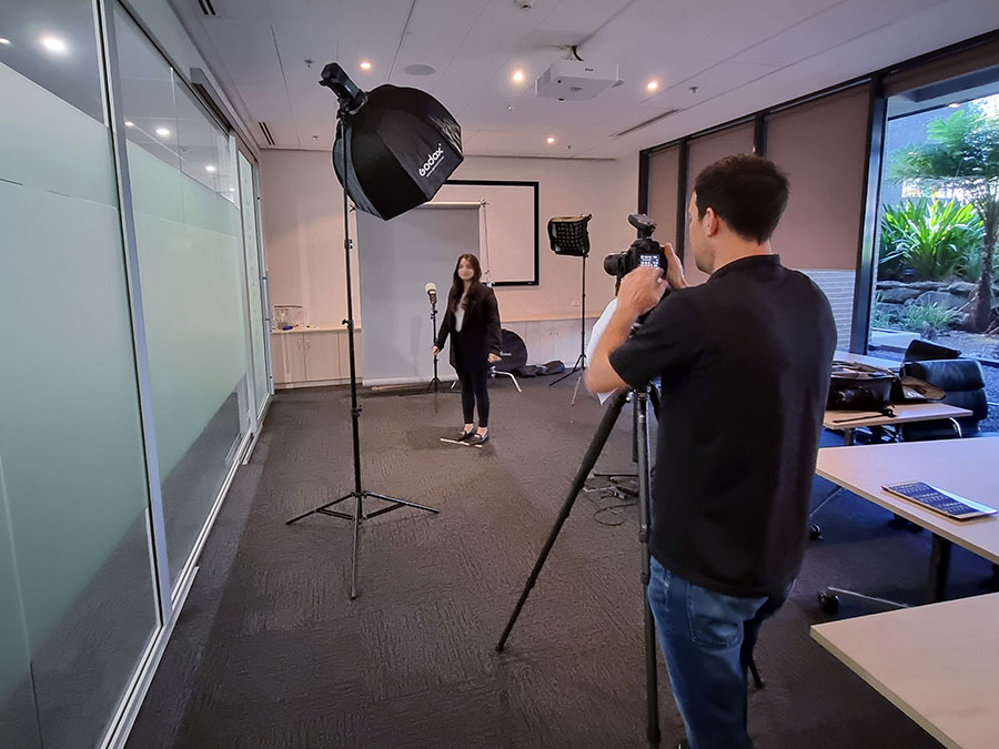 Behind the scenes image of a corporate headshot shoot in Macquarie Park, Sydney.