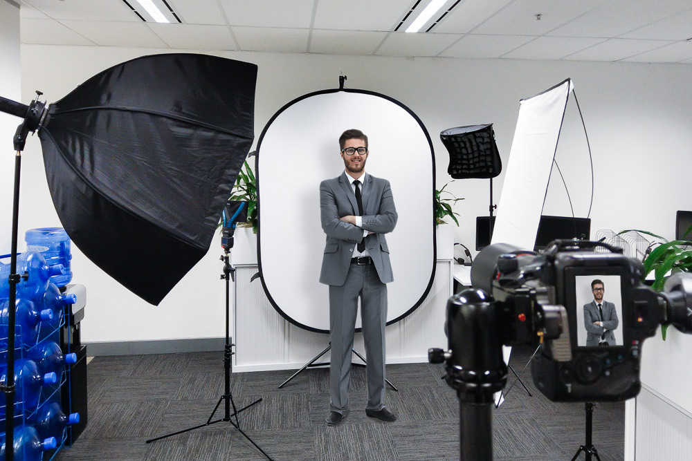 Sydney CDB corporate headshot behind the scenes photography setup of a man having his headshot taken.