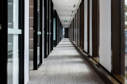 Interior architectural photography of a corporate office building corridor in Sydney.