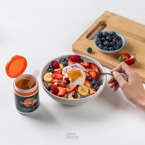Ecommerce product and food photography. Lifestyle photo of a bowl of cereal with supplements with a hand model.