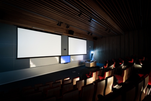 Low light interior photo of a lecture room taking by architecture photographer Adrian Harrison.