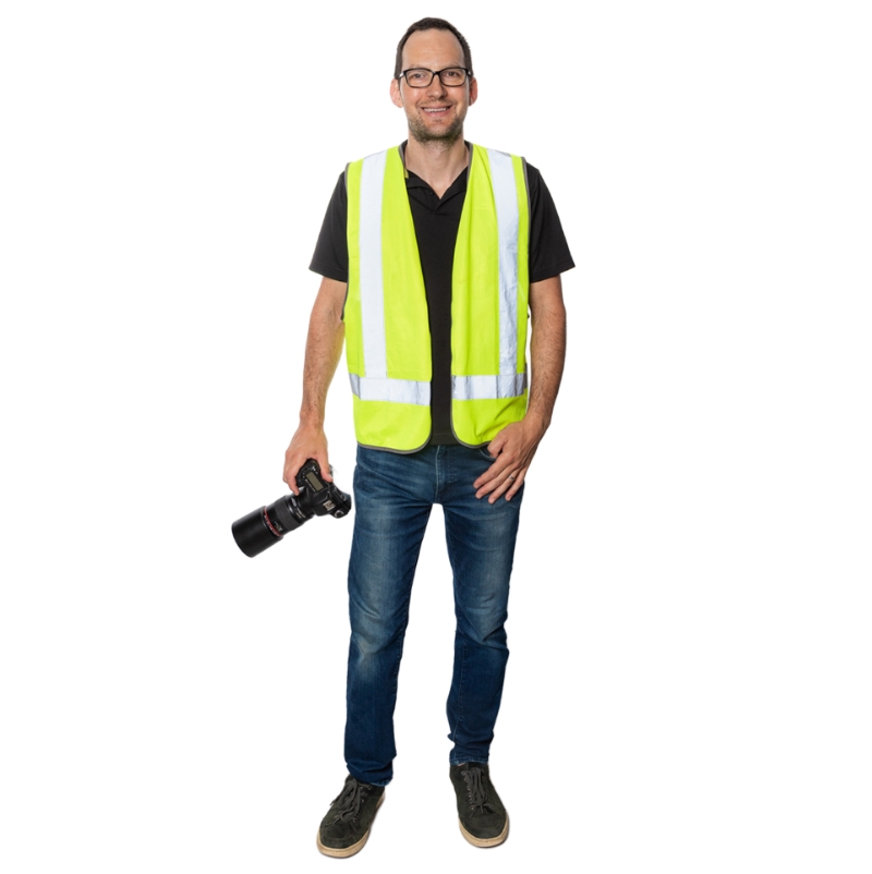 Sydney's best architectural photographer Adrian Harrison with camera and high vis vest.