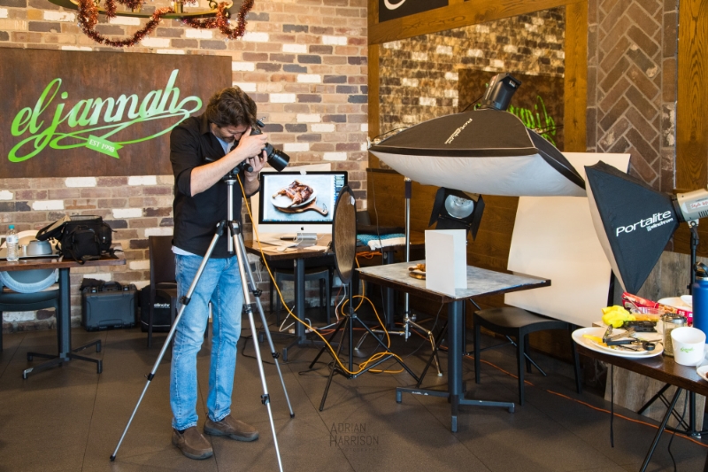 Behind the scenes of a food photography menu shoot for a take away restaurant. Photographer taking food photos.