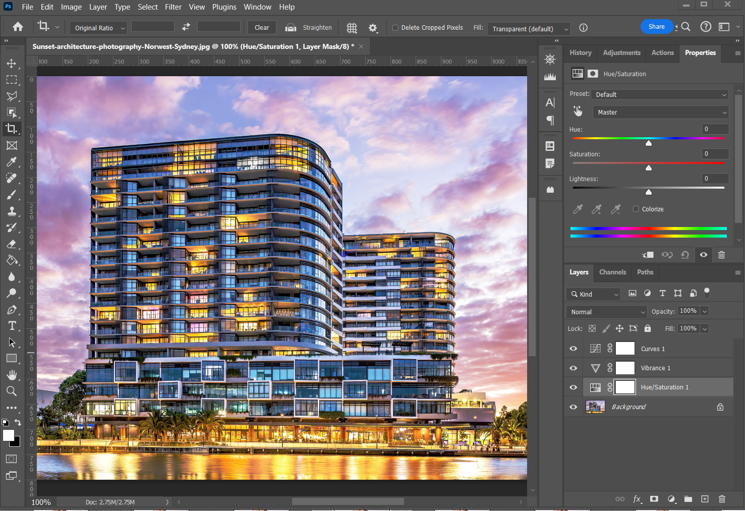 Architecture photographer in sydney editing an architectural photo of a building exterior at dusk in Adobe Photoshop.